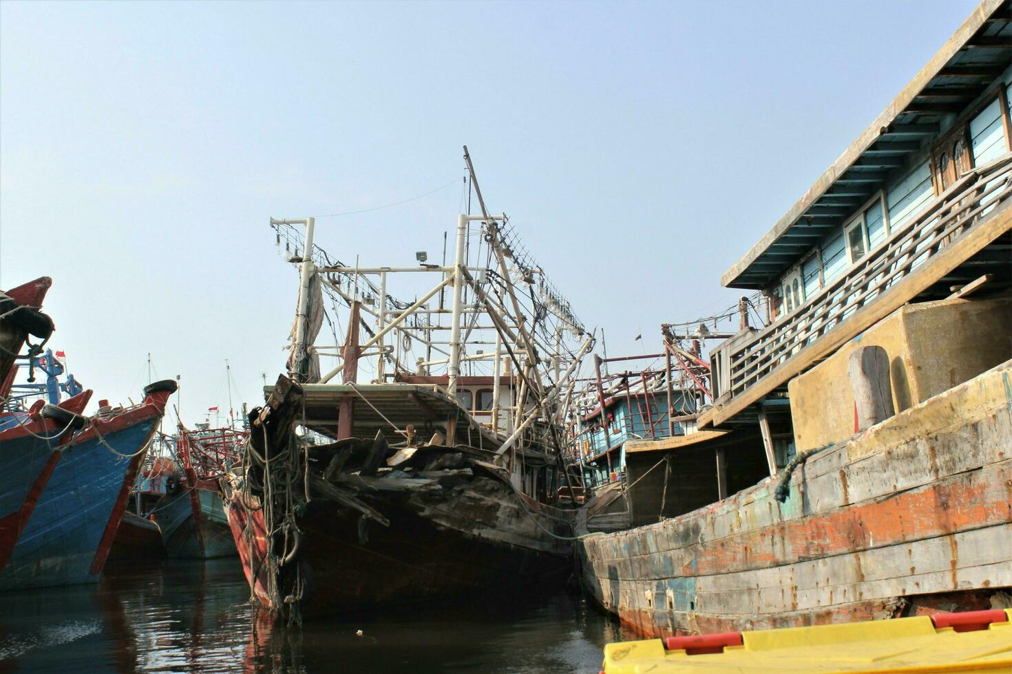 Jakarta, Indonesia-18 June 2023 fishing boats parked on the coast of Jakarta photo