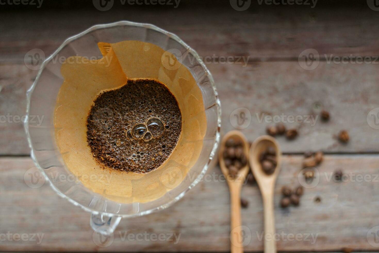 Drip coffee is a method of brewing pour-over or filter brewers in which the method of brewing coffee without a brewer is simply using water through coffee grounds and paper filter photo