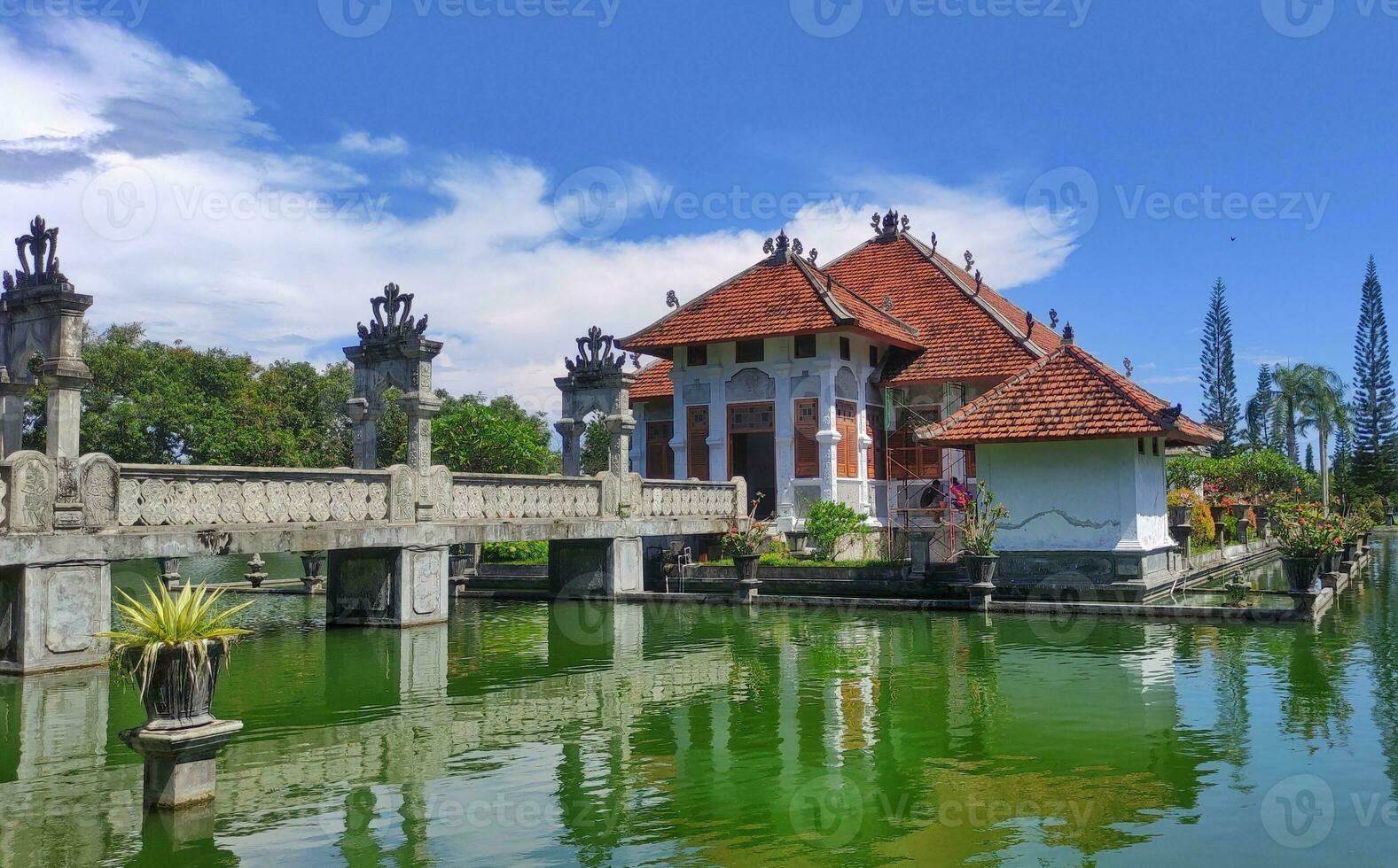 A historical building on the lake with bridge photo