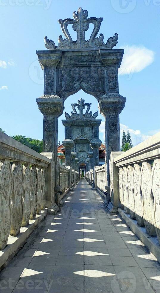 A stone bridge gateaway with ornament photo