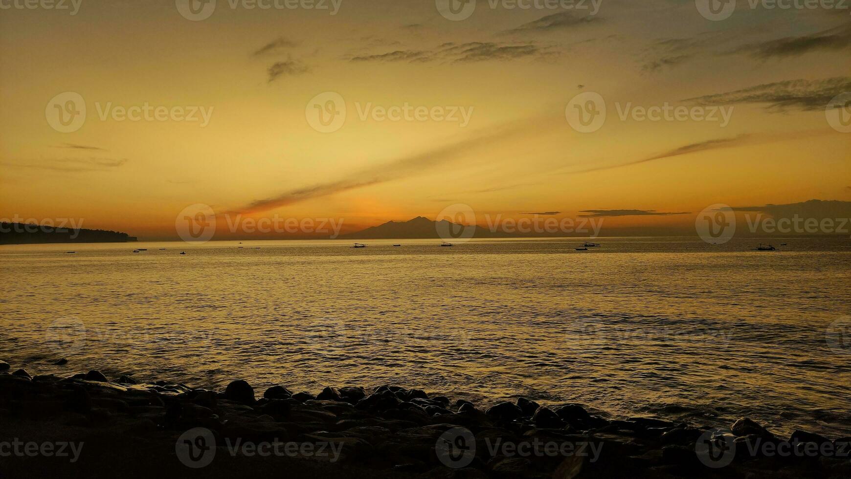 Sunrise morning in the beach with mountain view photo