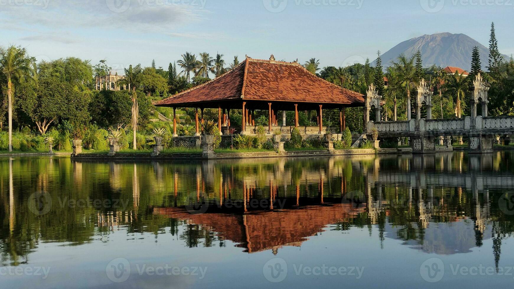 A historical building on the lake with bridge photo