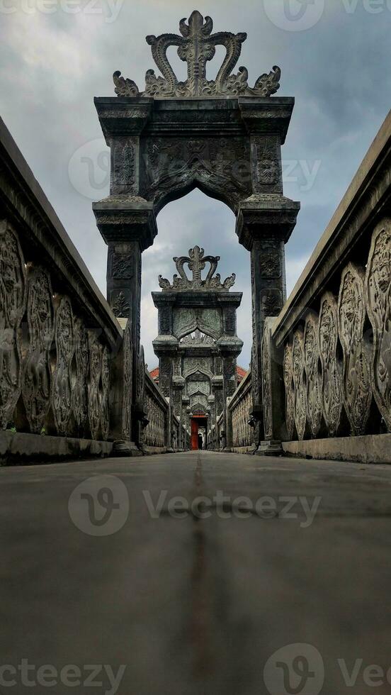 A stone bridge gateaway with ornament photo