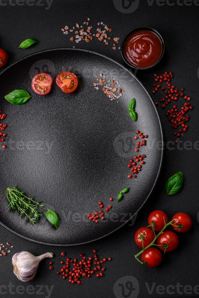 Ingredients for cooking cherry tomatoes, salt, spices and herbs photo