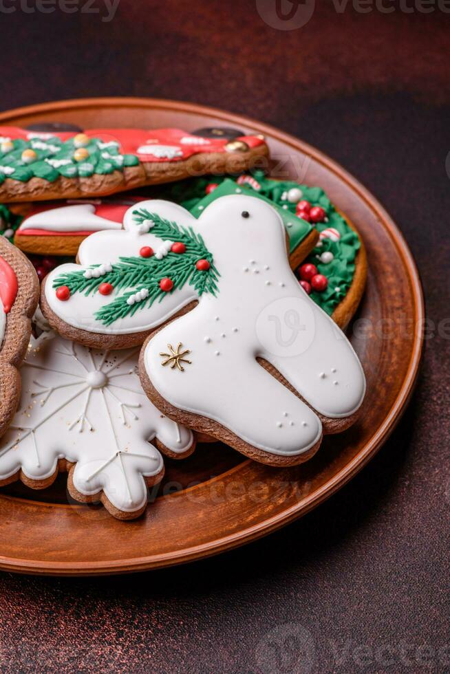 Beautiful delicious Christmas gingerbread on a concrete texture background photo