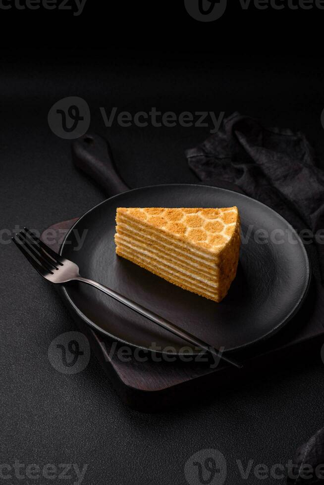 Delicious fresh sweet honey cake layer cake with white cream photo