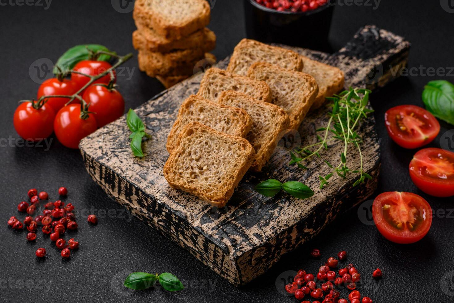 Delicious salted rectangular wheat croutons with salt and spices photo