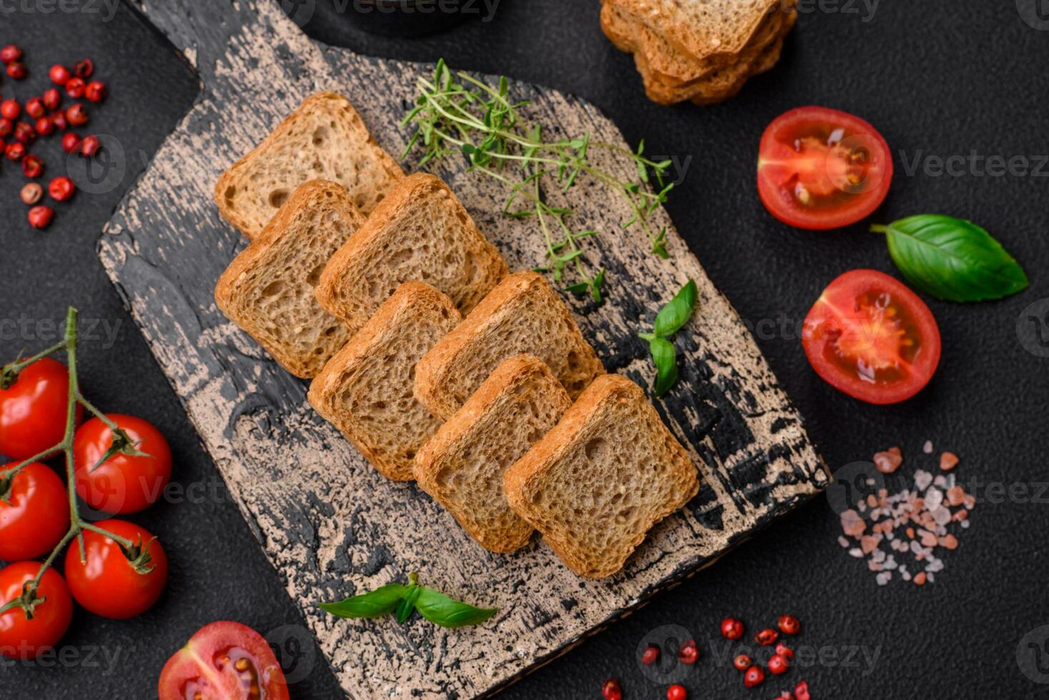 Delicious salted rectangular wheat croutons with salt and spices photo