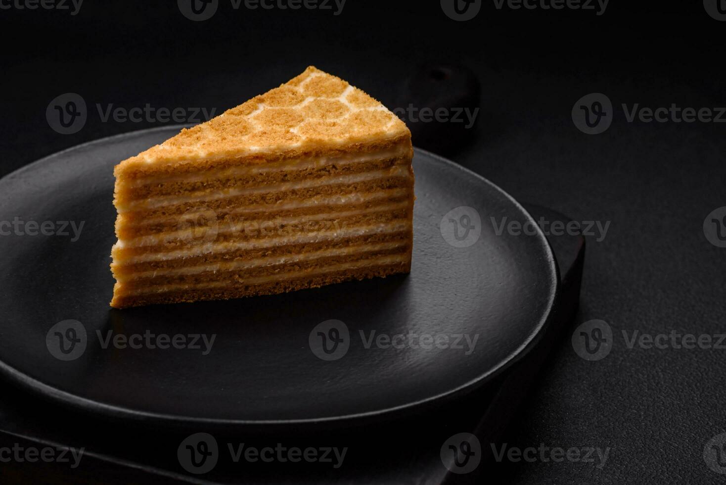 Delicious fresh sweet honey cake layer cake with white cream photo