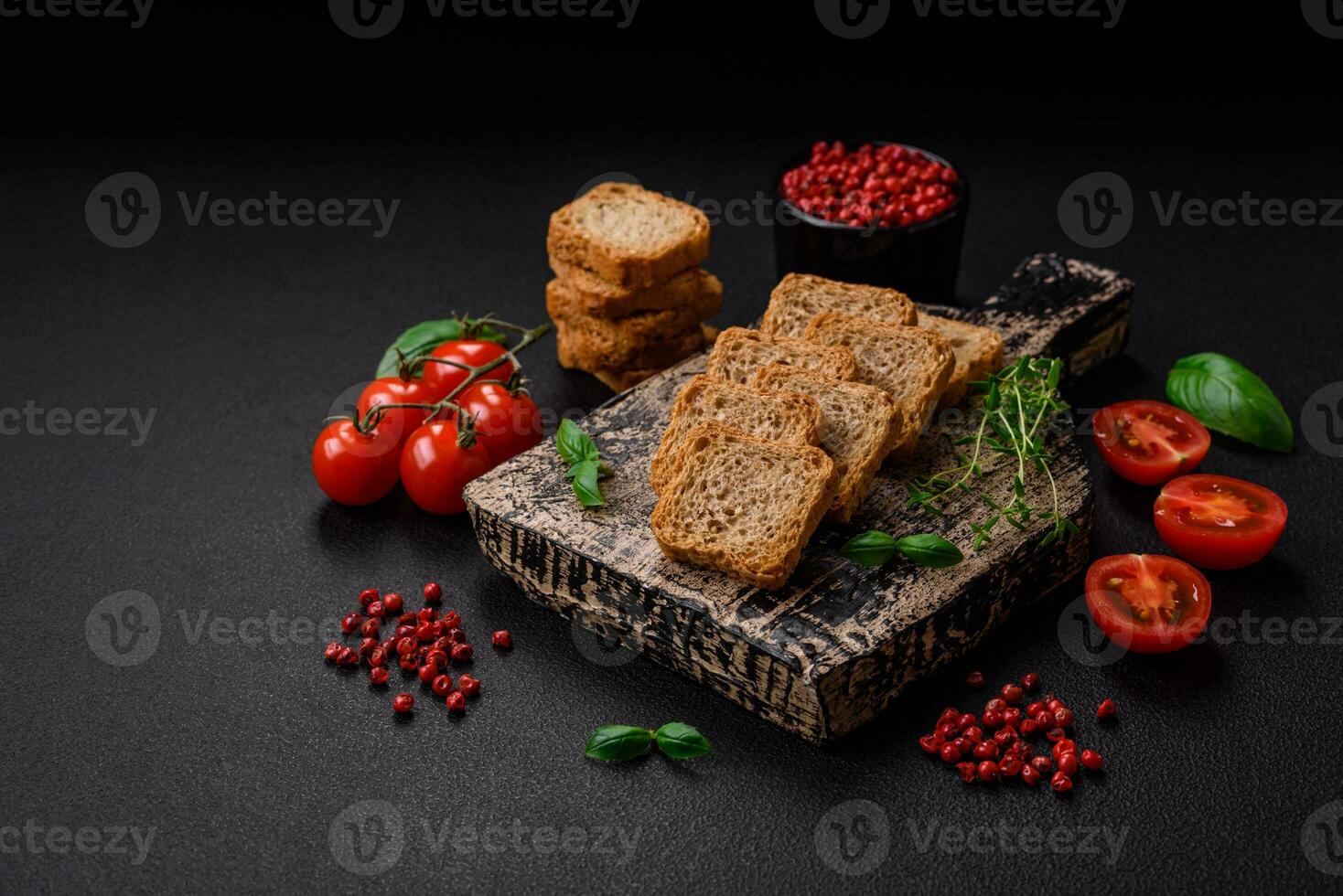 Delicious salted rectangular wheat croutons with salt and spices photo