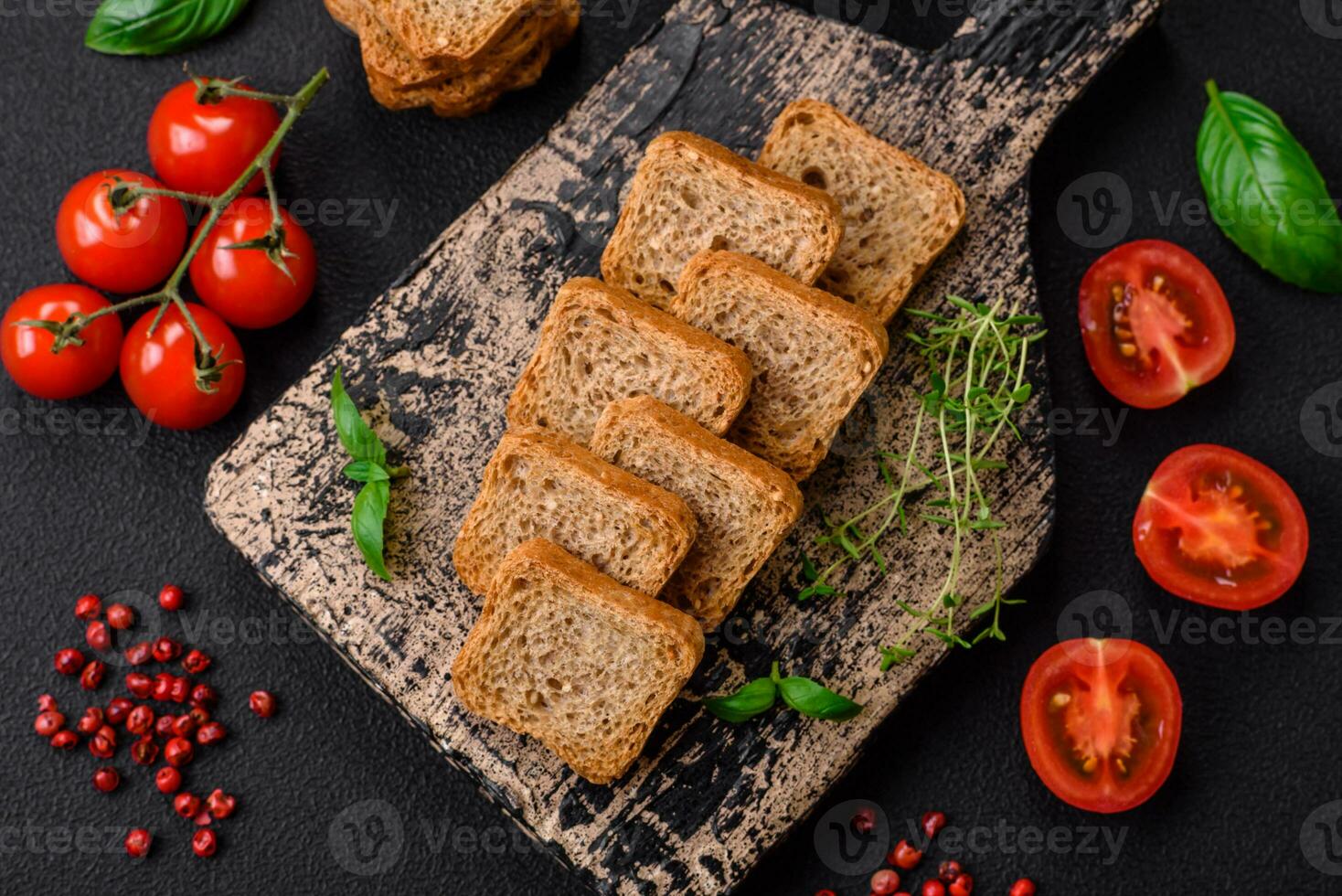 Delicious salted rectangular wheat croutons with salt and spices photo