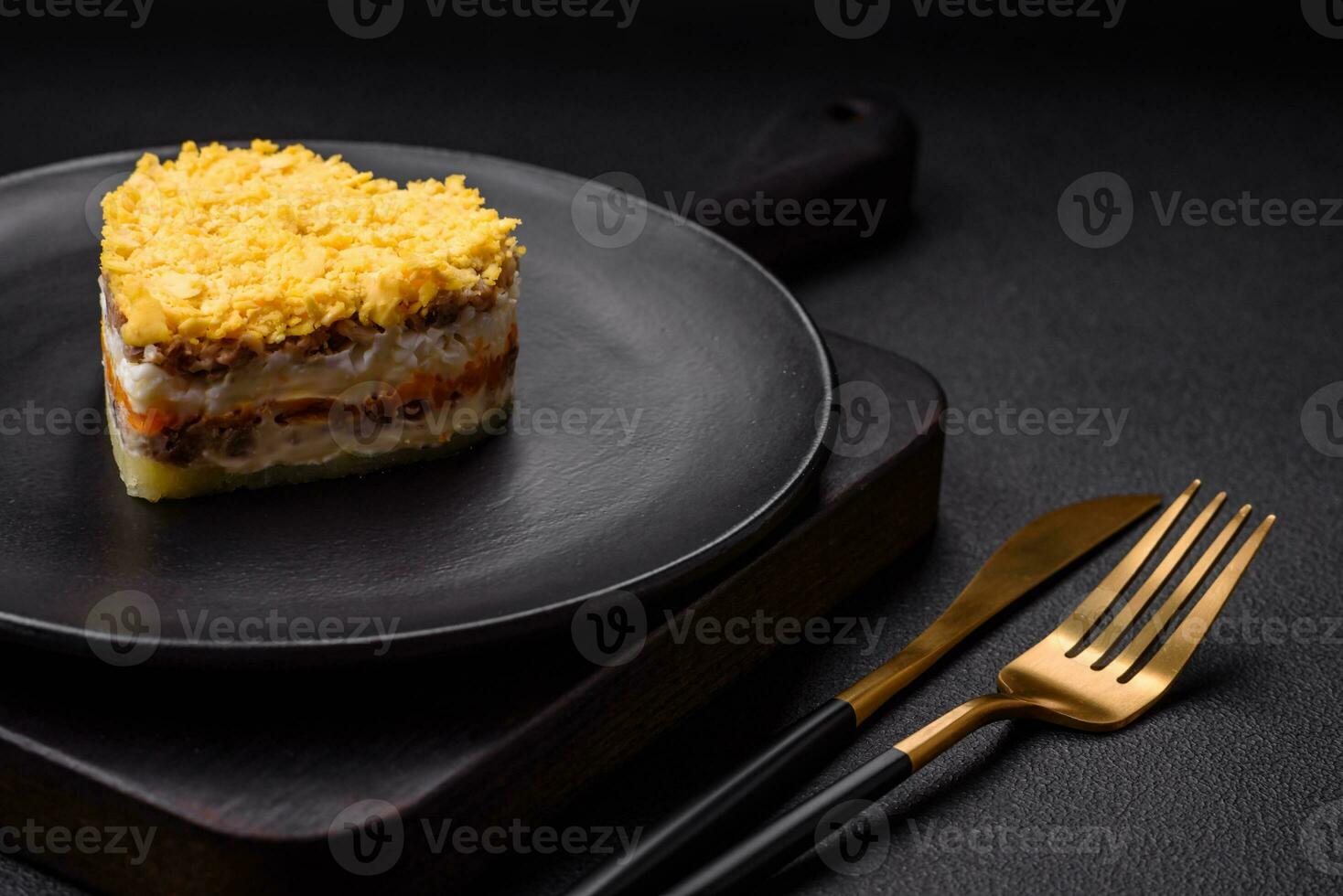 Delicious fresh mimosa salad with canned fish, egg, moinese, cheese, salt and spices photo