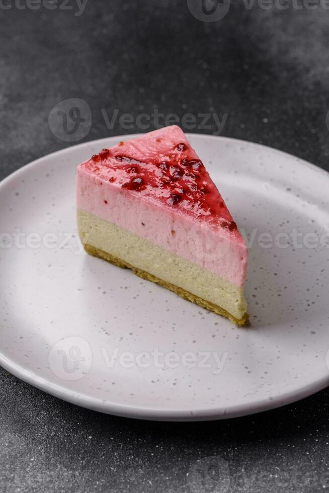 Delicious sweet dessert cheesecake with raspberry and pistachio flavor photo