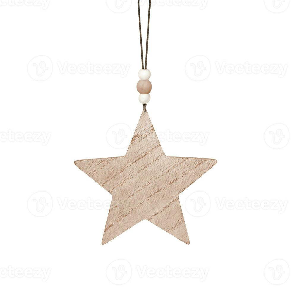 Hanging brown wooden star. Christmas ornament isolated on a white background. Stock photography. photo