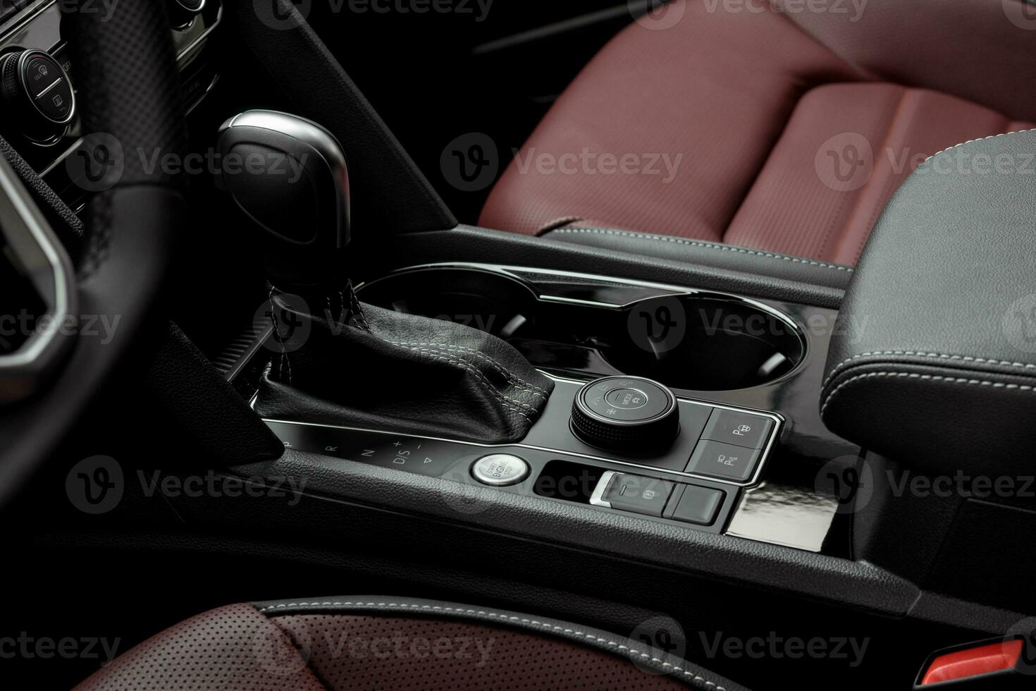 Luxury vehicle interior with red leather seats. start stop button and automatic gear lever photo