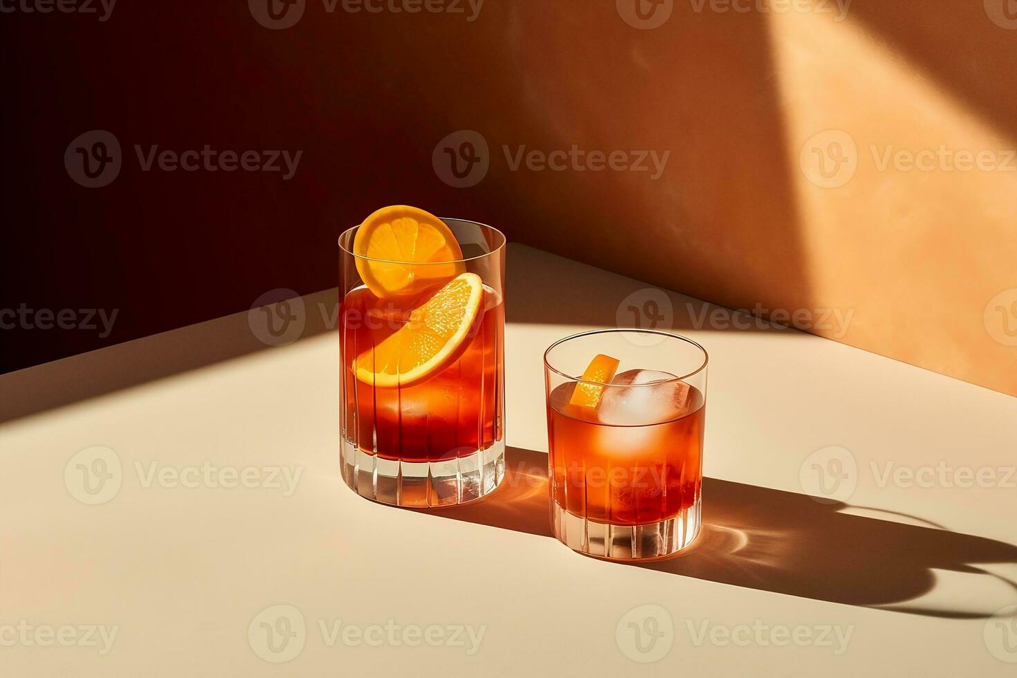 A close-up image of a table, with two Spritz cocktail glasses featuring slices of oranges, summer day photo