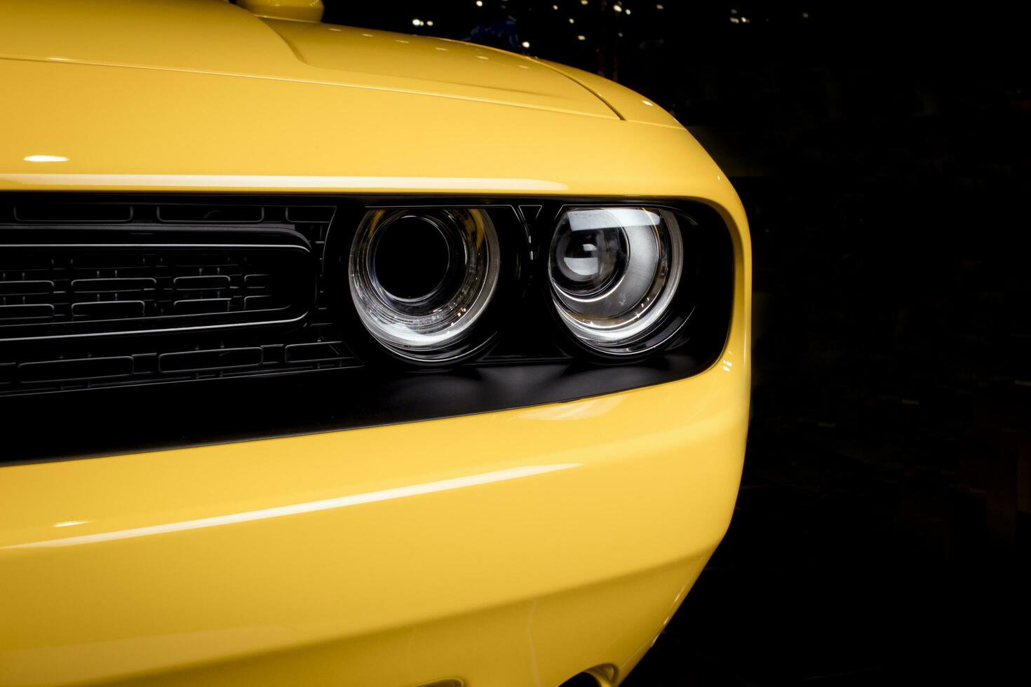 Headlight yellow muscle car - front view photo