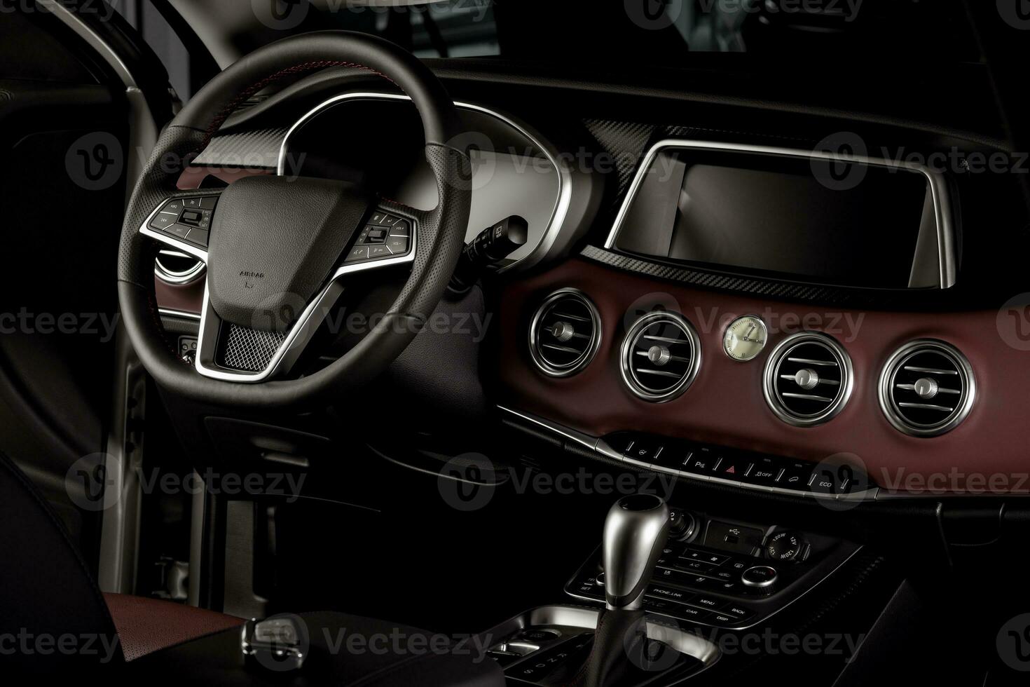 New car interior details with leather steering wheel, automatic