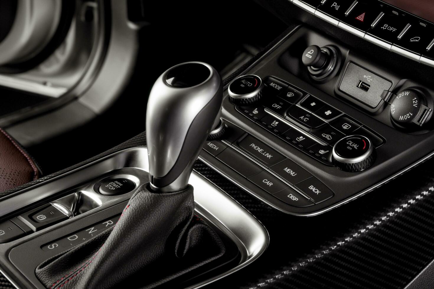 Electronic Gear Shift close up inside a new car with start stop button and electronic hand brake photo