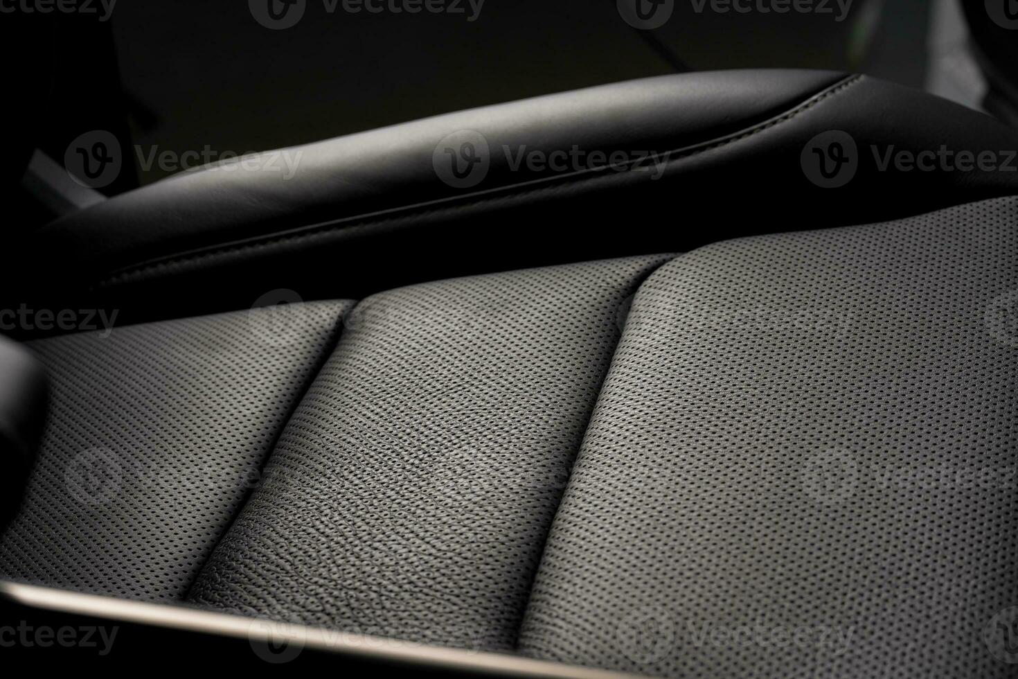 Closeup shot of the black seat surface inside a car photo