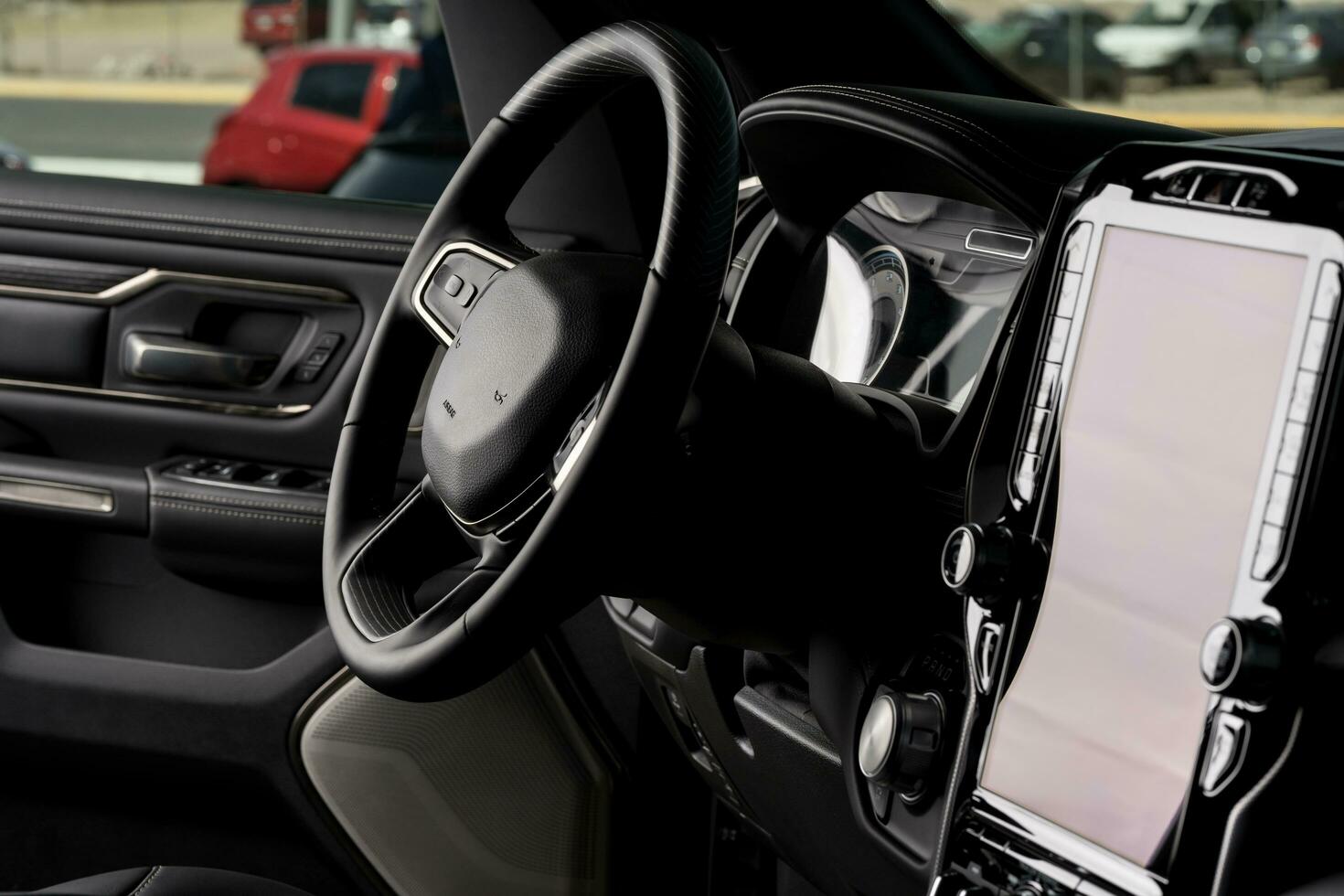 Front part of new automobile. modern black interior, steering wheel, and touch screen center console photo