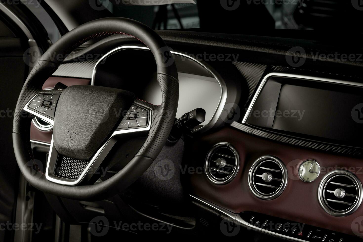 Electric car interior with digital speedometer and touch center console display, leather-wrapped steering wheel photo