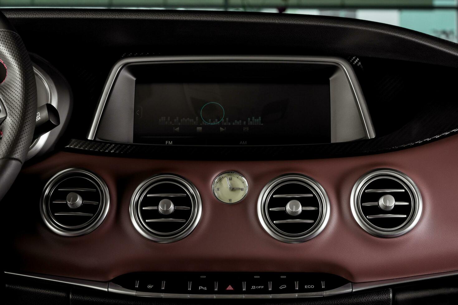 Close up car ventilation system and air conditioning, details and controls of modern vehicle with smart multimedia touch screen system photo