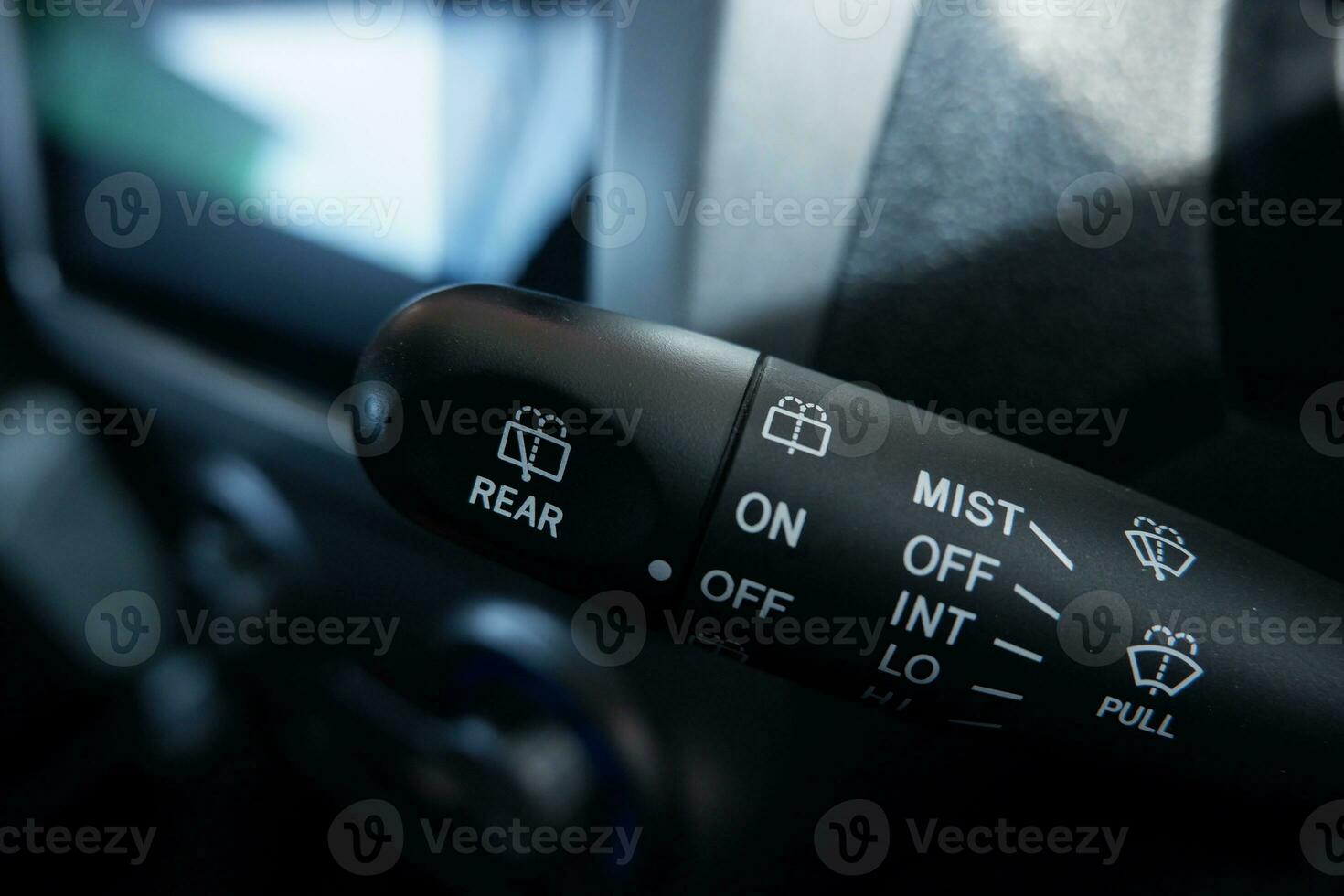 selective focus handle to control the windshield wiper in car. Modern car interior detail. adjusting speed of screen wipers in car. photo
