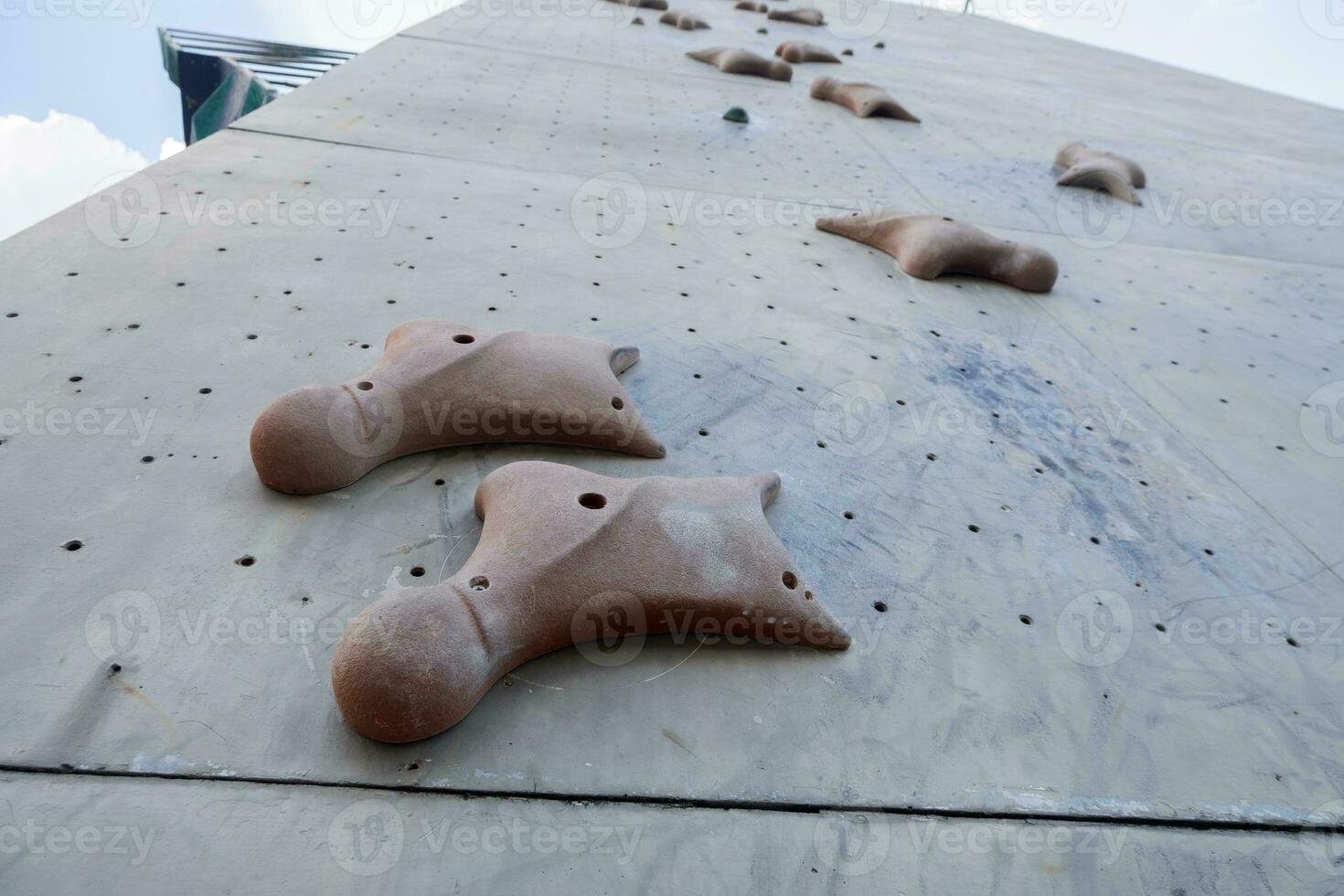 selective focus on artificial rock for rock climbing sports photo