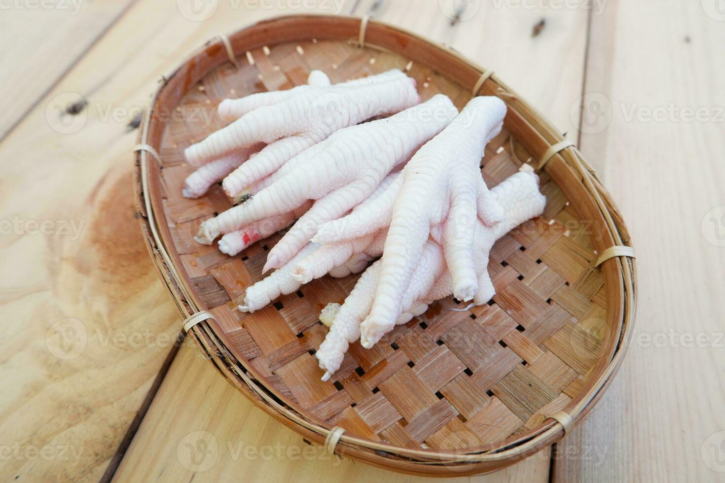 selectively focus on pieces of chicken feet or claws which are ready to be cooked in Indonesian called ceker. soft focus photo