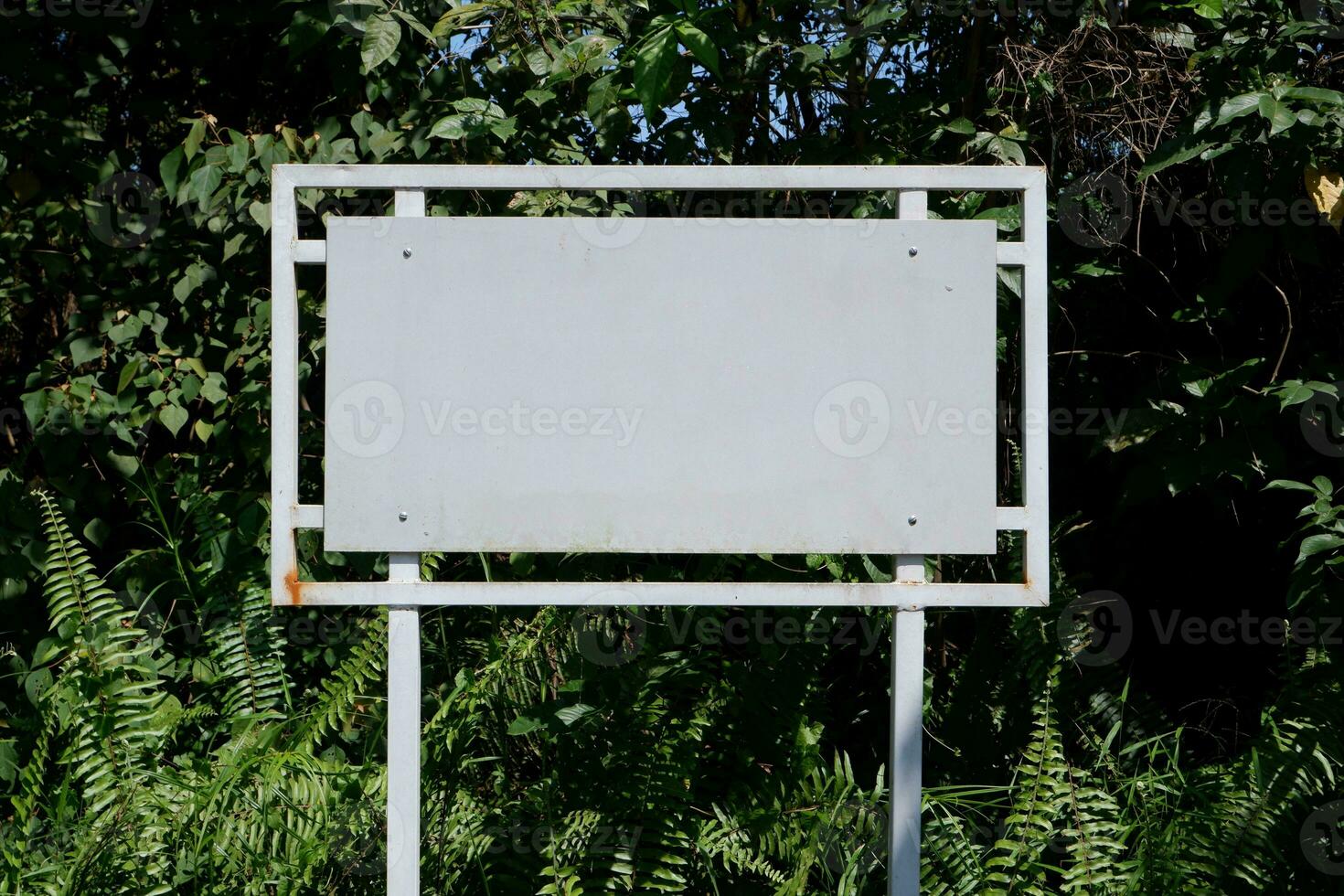 selevtive focus on Realistic white traffic sign on two metal poles. Rectangular blank traffic road empty sign. Mock up template for your design. photo