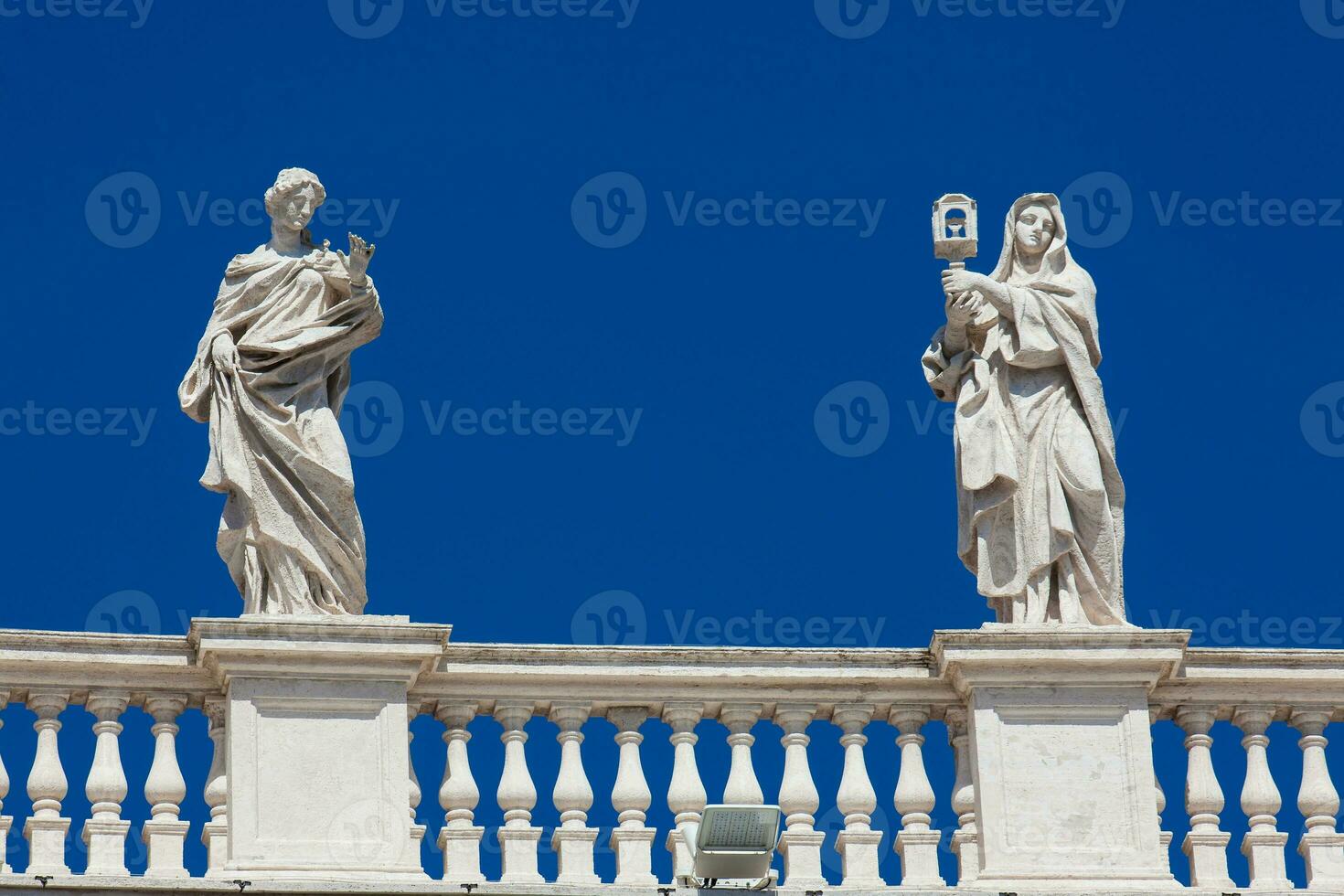 Detail of the statues of saints that crown the colonnades of St. Peter Square built on 1667 on