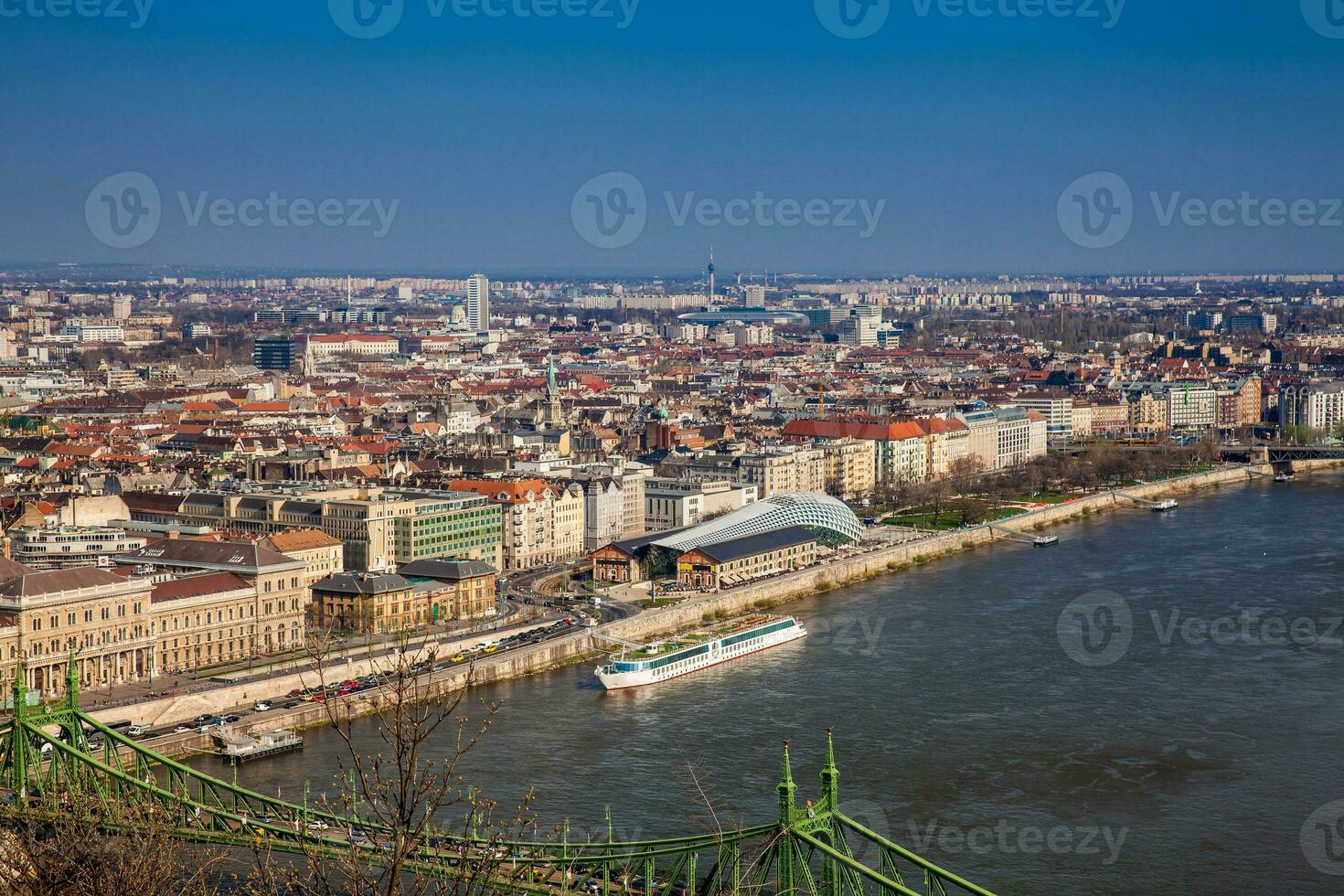 View of the beautiful Budapest city and Danube river under the blue sky photo