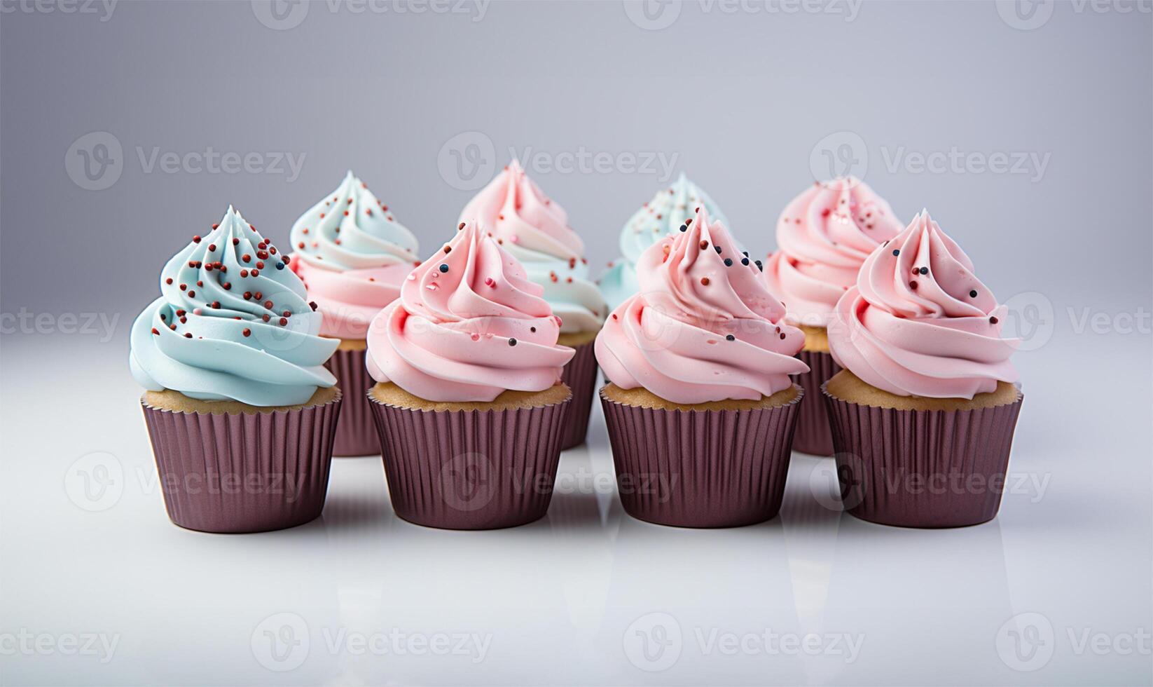 Cupcakes with blue and pink decoration on white background, close up view. AI Generated photo