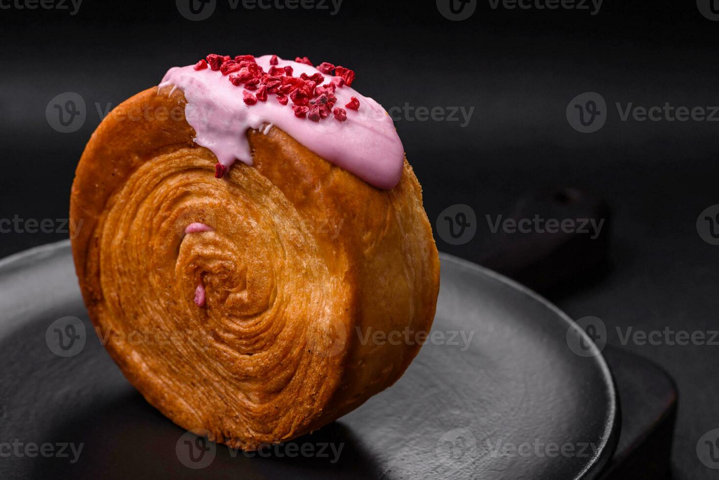 Round puff pastry croissant with raspberry filling or new york roll photo