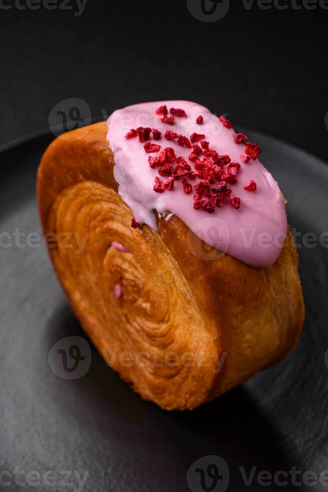 Round puff pastry croissant with raspberry filling or new york roll photo