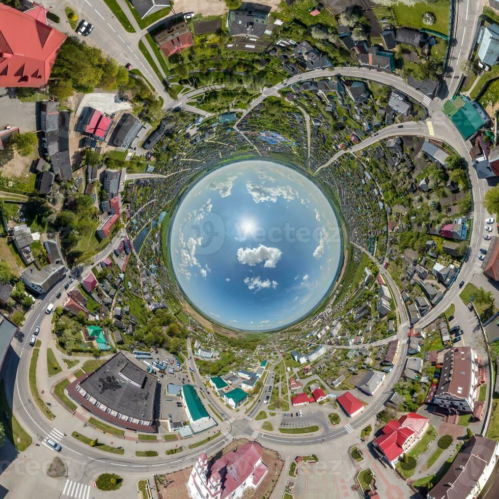 blue sphere inside overlooking old town, urban development, historic buildings and crossroads. Transformation of spherical 360 panorama in abstract aerial view. photo