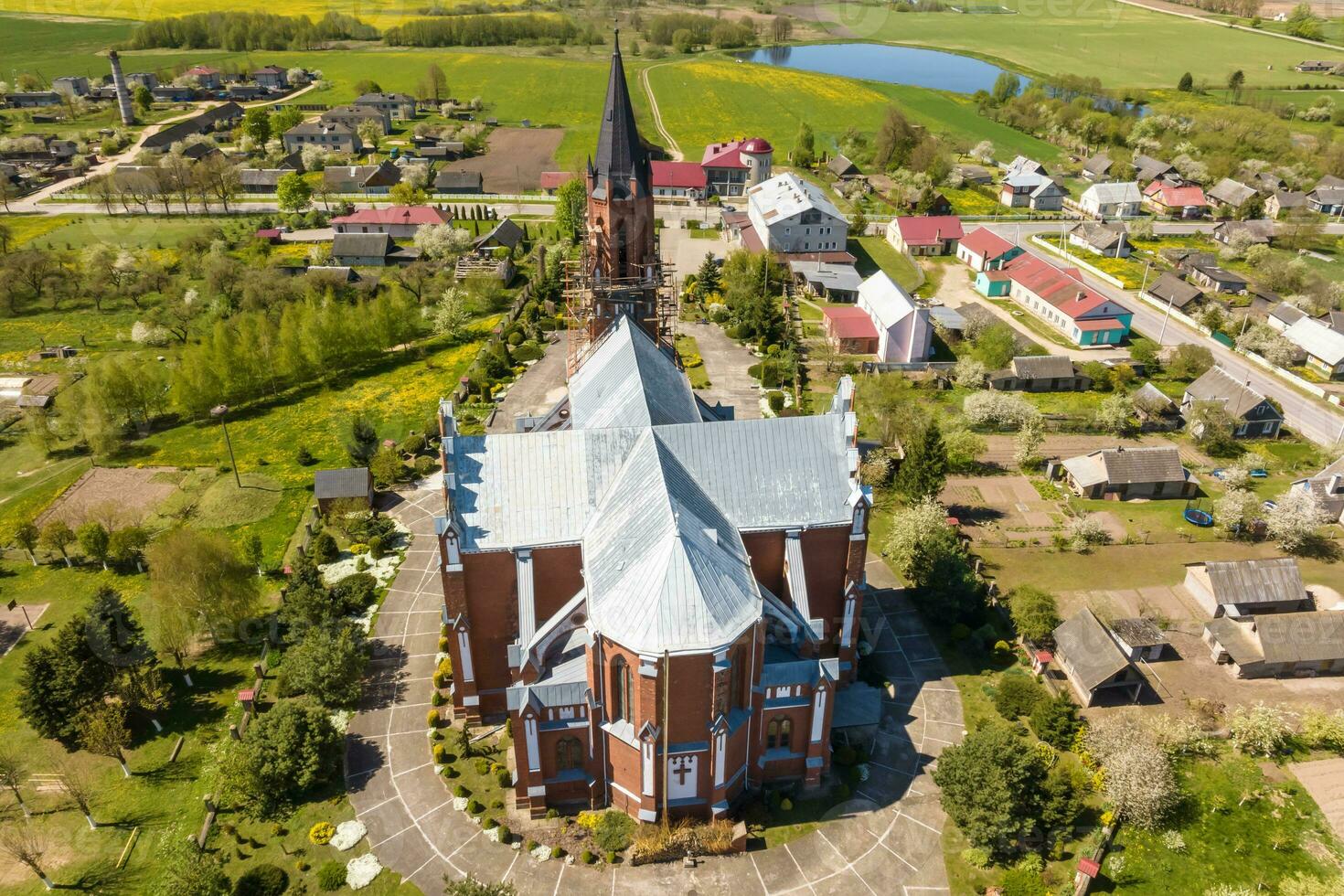 aerial view on neo gothic or baroque temple or catholic church in countryside photo