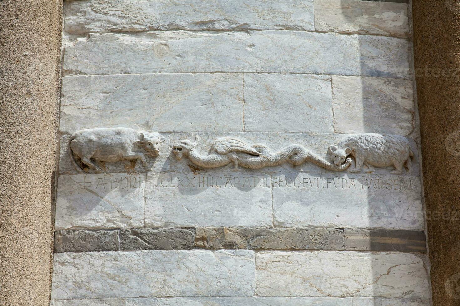 Detail of the stone carvings on the walls of the Leaning Tower of Pisa photo