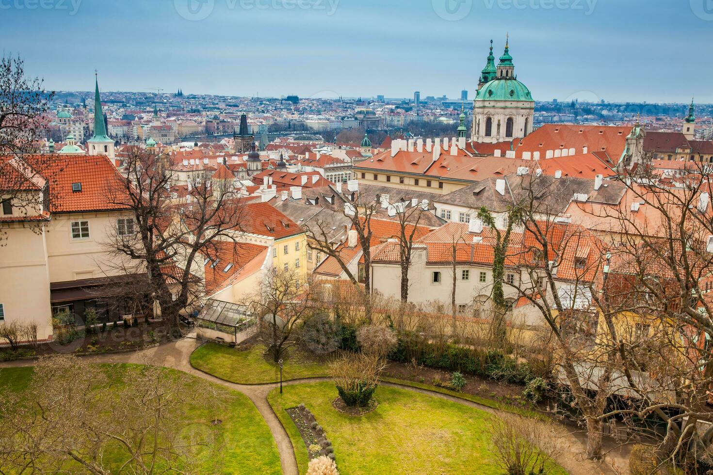 The beautiful Prague city old town seen form the Prague Castle viewpoint in an early spring day photo