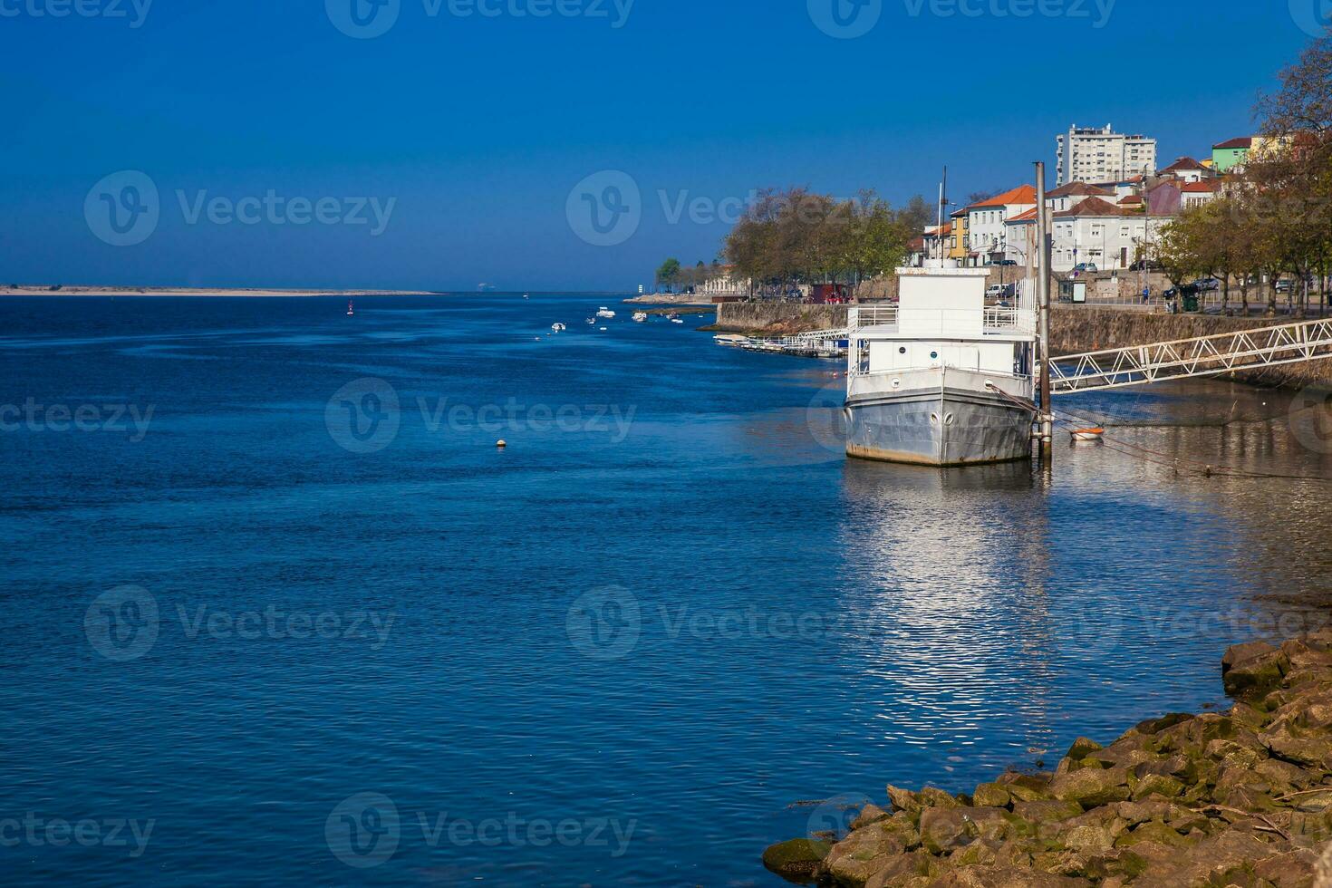 Old ship at Douro River mouth in a beautiful early spring day at Porto City in Portugal photo