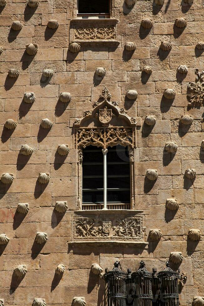 Detail of the windows of the historical House of the Shells built in 1517 by Rodrigo Arias de Maldonado knight of the Order of Santiago de Compostela in Salamanca, Spain photo