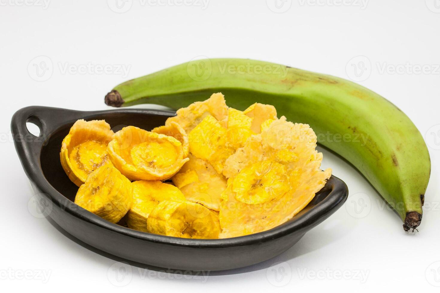 Raw plantain cups, patacones and pieces on white background photo