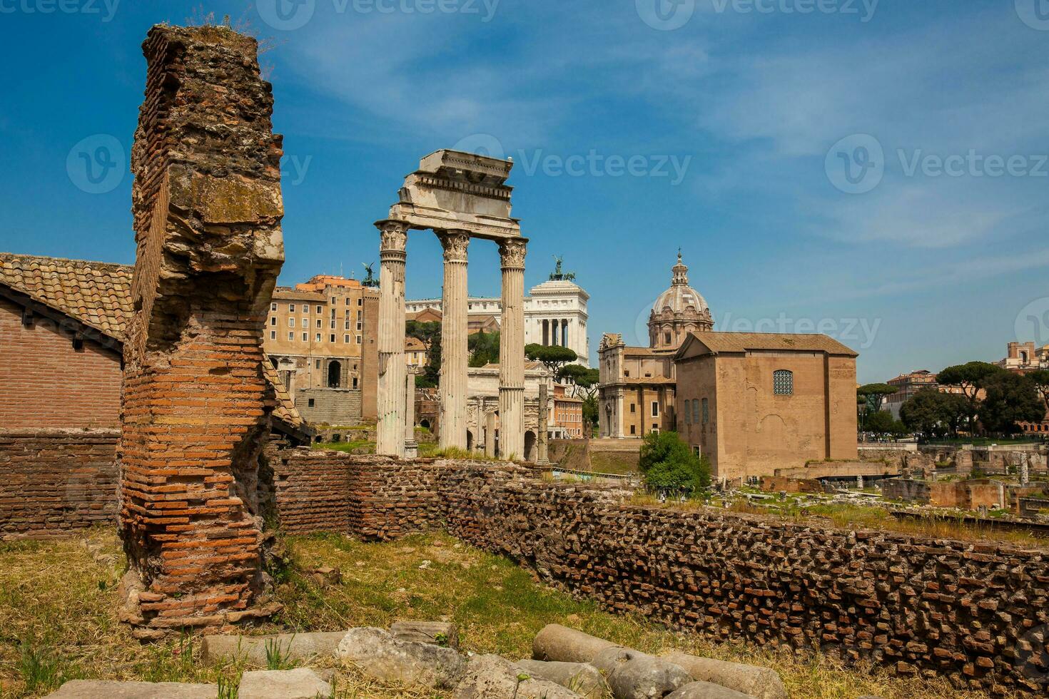 Remains of the Temple of Castor and Pollux or the Dioscuri at the Roman Forum in Rome photo