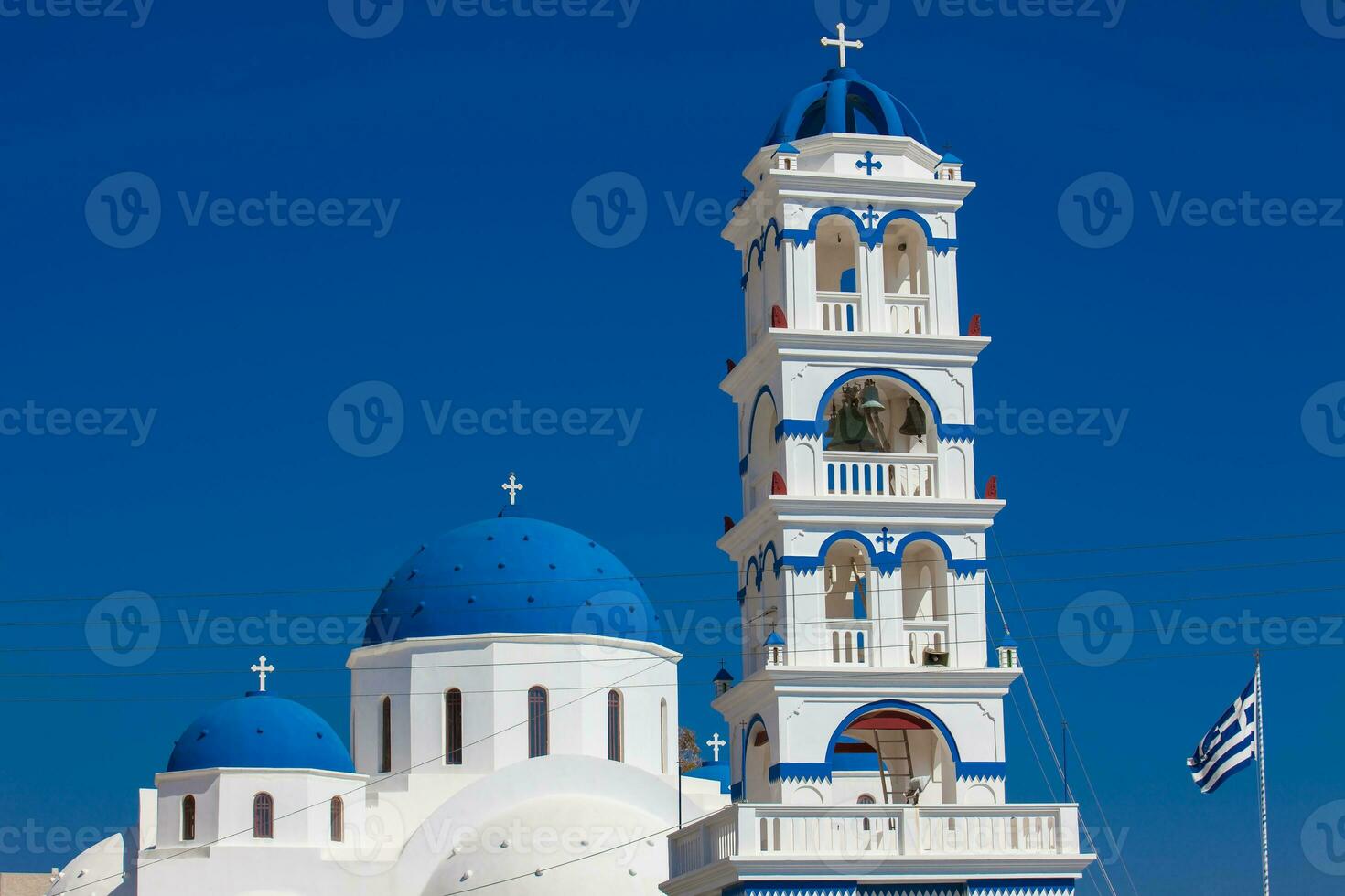 The Church of Holy Cross in the central square of Perissa on Santorini Island photo