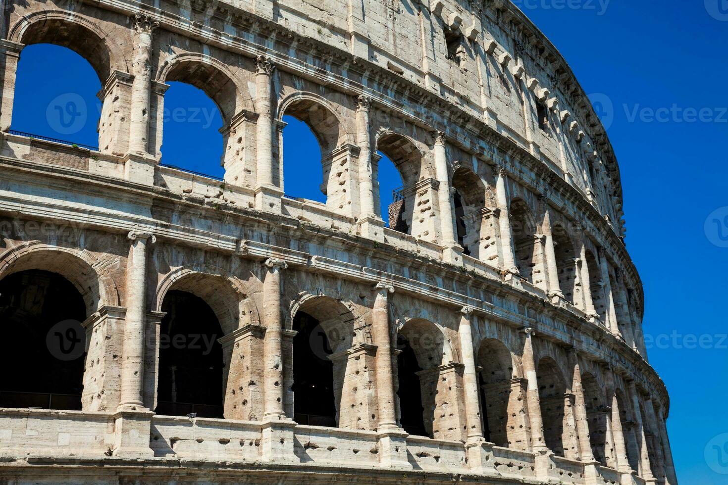 Detail of the famous Colosseum or Coliseum also known as the Flavian Amphitheatre in the centre of the city of Rome photo