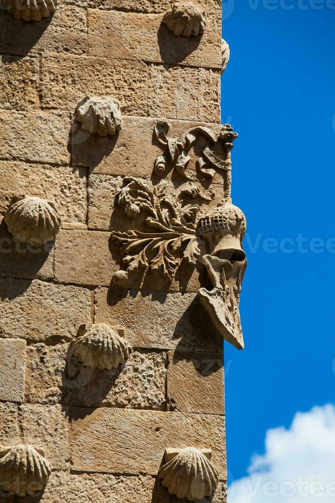 Detail of decorations on the facade of the historical House of the Shells built in 1517 by Rodrigo Arias de Maldonado knight of the Order of Santiago de Compostela in Salamanca, Spain photo