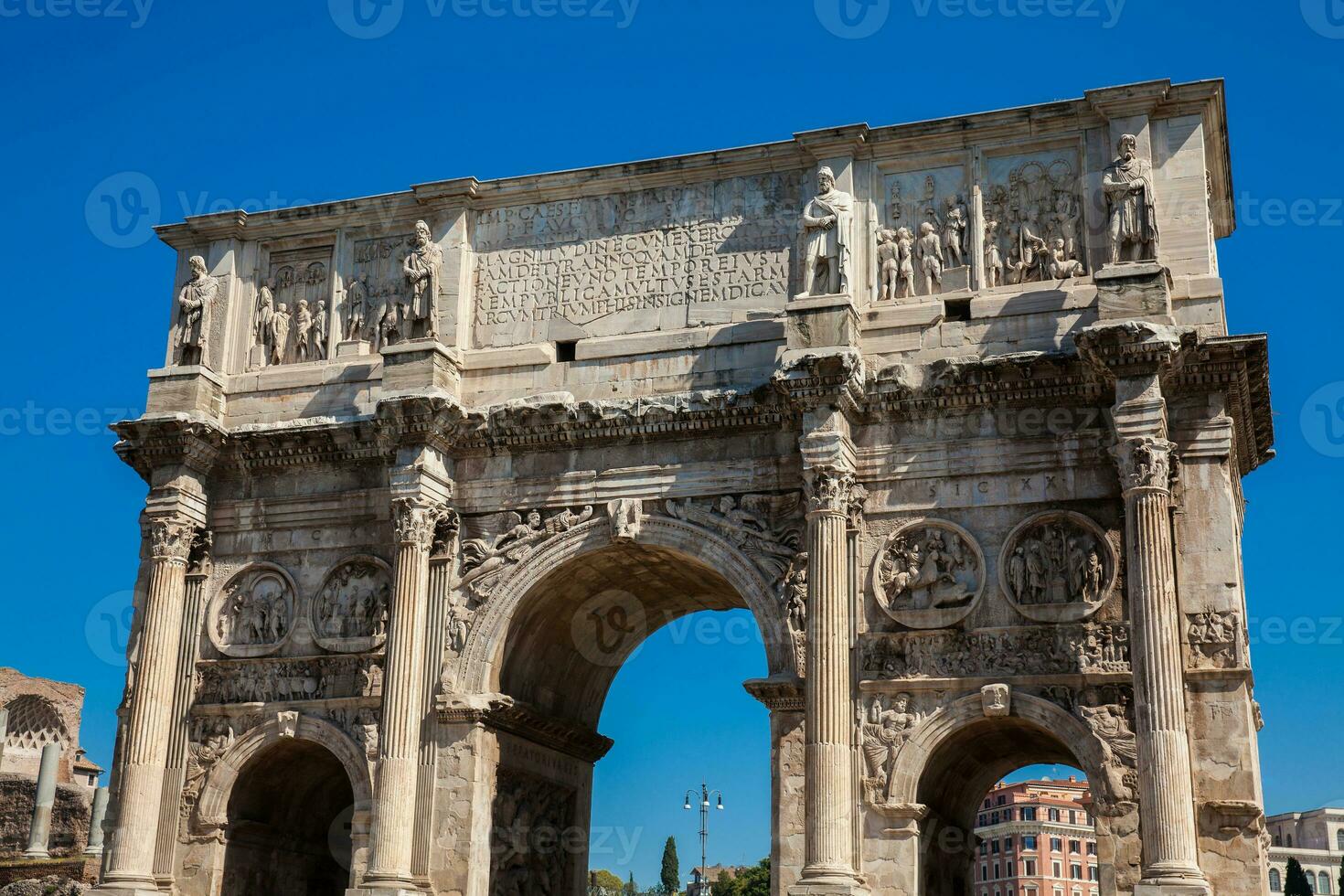 The Arch of Constantine a triumphal arch in Rome, situated between the Colosseum and the Palatine Hill built on the year 315 AD photo