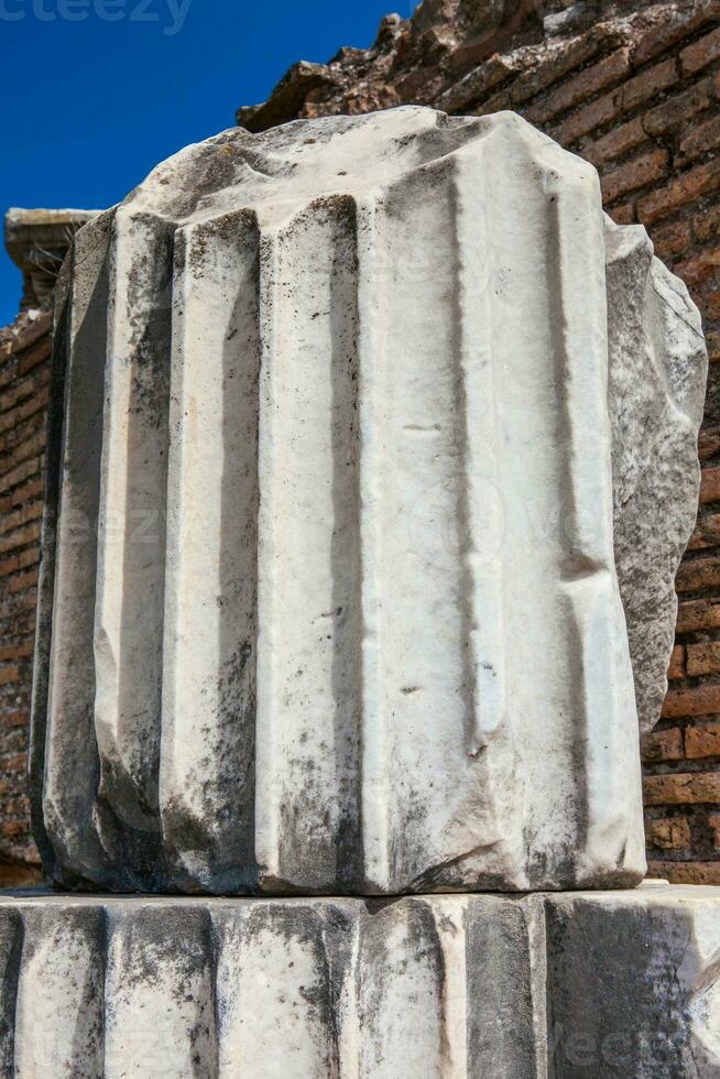 Remains of columns of the ancient buildings at the Roman Forum in Rome photo