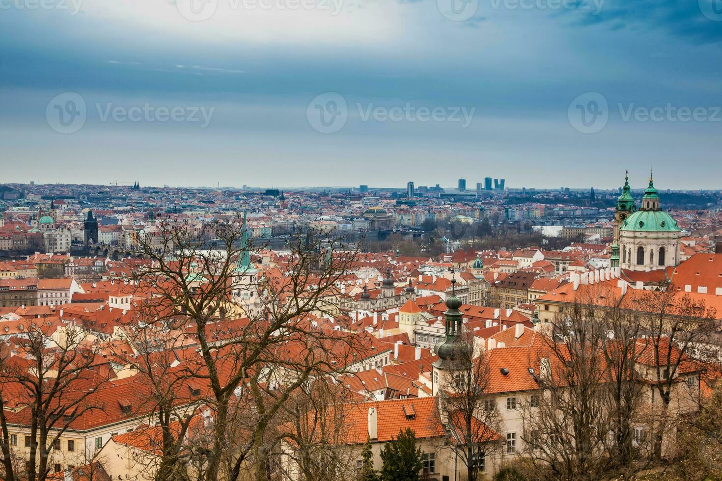 The beautiful Prague city old town seen form the Prague Castle viewpoint in an early spring day photo